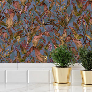 Seahorse Mangrove wallpaper by Brand McKenzie in lilac and orange, seahorses among mangrove leaves behind bar stools