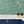 Seahorse Mangrove wallpaper by Brand McKenzie in green, seahorses among mangrove leaves above kitchen cabinets