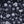 Seasons in Bloom wallpaper by Victoria Sanders in navy and lilac, close-up of a meadow of flowers rising from the base