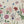 Seasons in Bloom wallpaper by Victoria Sanders in cream, detail of a meadow of flowers rising from the base