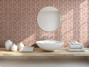 Shell Seekers wallpaper by Liberty James Studio in pink, a scallop shell pattern in a bathroom setting