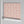 Shell Seekers wallpaper by Liberty James Studio in pink, sample roll showing a scallop shell pattern