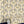 Shell Seekers wallpaper by Liberty James Studio in blue and yellow, partly unrolled roll showing a scallop shell pattern