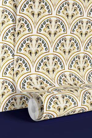 Shell Seekers wallpaper by Liberty James Studio in blue and yellow, partly unrolled roll showing a scallop shell pattern