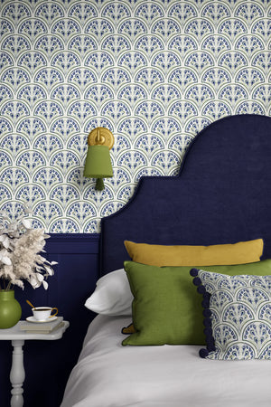 Shell Seekers wallpaper by Liberty James Studio in blue, a scallop shell pattern in a bedroom