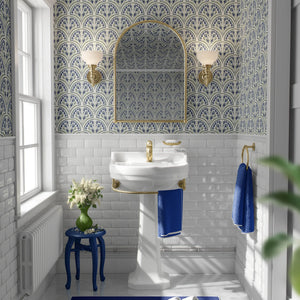 Shell Seekers wallpaper by Liberty James Studio in blue, a scallop shell pattern in a bathroom