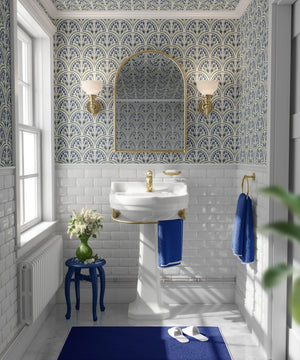 Shell Seekers wallpaper by Liberty James Studio in blue, a scallop shell pattern in a bathroom