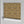Shell Seekers wallpaper by Liberty James Studio in gold, sample roll showing a scallop shell pattern