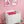 Shell Seekers wallpaper by Liberty James Studio in pink, a scallop shell pattern behind a daybed in a child's room