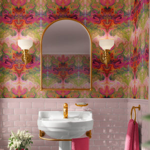 Siesta Key wallpaper by Liberty James Studio in pink and green, a marbled mirrored design in a bathroom