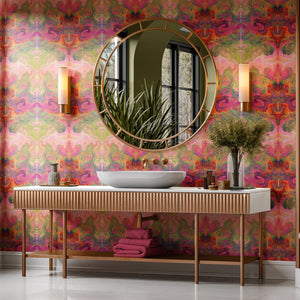 Siesta Key wallpaper by Liberty James Studio in pink and green, a marbled mirrored design on a bathroom wall