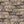 Silk Shades wallpaper by Brand McKenzie in grey, close view of layered silk lampshades