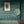 Soltar wallpaper by Tatie Lou in teal, a Deco arch pattern in a living room