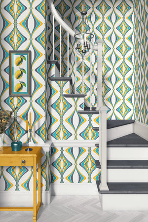 Hourglass wallpaper by Liberty James Studio in turquoise and yellow, a retro hourglass wave above a sideboard