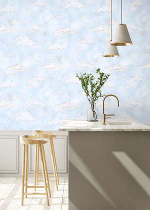 Starry Clouds wallpaper by Brand McKenzie in pale blue, soft clouds and stars above kitchen cabinets
