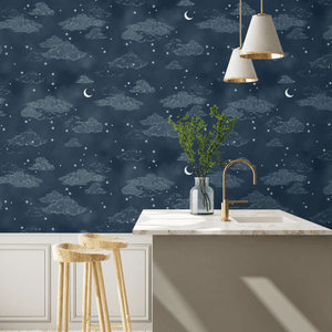 Starry Clouds wallpaper by Brand McKenzie in navy, soft clouds and stars above kitchen cabinets