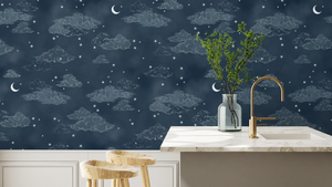 Starry Clouds wallpaper by Brand McKenzie in navy, soft clouds and stars behind bar stools