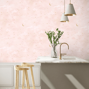 Starry Clouds wallpaper by Brand McKenzie in pink, soft clouds and stars above kitchen cabinets