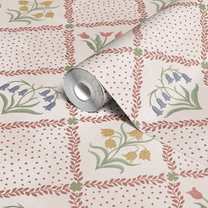 First Signs wallpaper by Studio Le Cocq in brown, roll showing a floral trellis (alternate view)