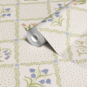 First Signs wallpaper by Studio Le Cocq in brown, roll showing a floral trellis