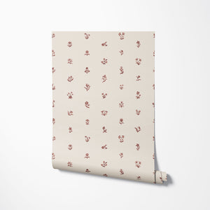 Cottage Ditsy wallpaper by Studio Le Cocq in burgundy, roll showing scattered ditsy flowers