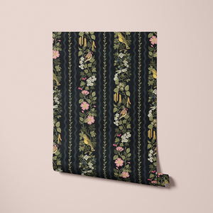 Hedgerows wallpaper by Studio Le Cocq in black, sample roll showing hedgerow flowers and birds in stripes