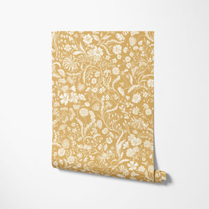 The Lost Garden Wallpaper in Honeysuckle wallpaper by Studio Le Cocq in yellow, partly unrolled roll showing
