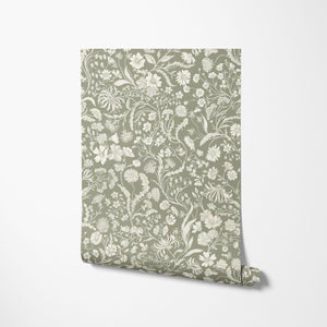 The Lost Garden wallpaper by Studio Le Cocq in terracotta, roll showing a dense garden of flowers
