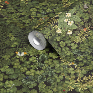 Woodland Floor wallpaper by Studio Le Cocq in dark green, sample roll showing woodland flowers and ferns