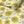 Sunflower and Flora wallpaper by Seed Home Designs in cream, partly unrolled roll showing large sunflowers
