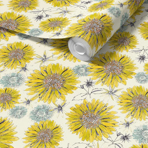 Sunflower and Flora wallpaper by Seed Home Designs in cream, partly unrolled roll showing large sunflowers