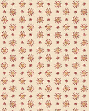 Sunshine Masquerade wallpaper by Annika Reed in cream and red, flat sample of sun and mask motifs