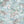 Tiger Lily wallpaper by Brand McKenzie in pale blue, tigers among lilies on a bathroom wall