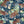 Tiger Lily wallpaper by Brand McKenzie in navy, close view of tigers among lilies