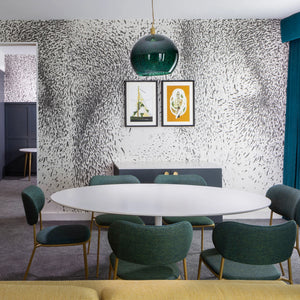 Disorder in Stasis Type II vinyl wallpaper by The Monkey Puzzle Tree in black and white in a dining area