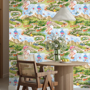 Tally Ho! wallpaper by Brand McKenzie in green and blue, a countryside landscape in a dining area