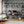 The Architecture wallpaper by Brand McKenzie in grey, overgrown classical buildings in a home office