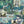 The Art Deco Hills wallpaper by Brand McKenzie in aqua, detail of Art Deco hillside scenes