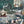 The Art Deco Hills wallpaper by Brand McKenzie in grey, detail of Art Deco hillside scenes