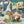 The Art Deco Hills wallpaper by Brand McKenzie in cream, close view of Art Deco hillside scenes