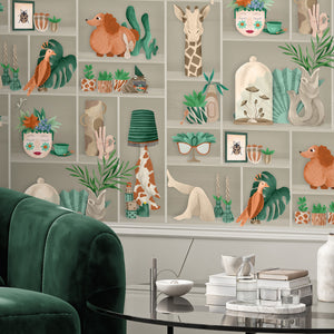 The Cabinet wallpaper by Brand McKenzie in green and amber, close-up of a cabinet of curiosities