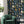 The Cabinet wallpaper by Brand McKenzie in navy and mustard, a cabinet of curiosities in a living room