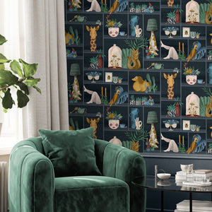 The Cabinet wallpaper by Brand McKenzie in navy and mustard, a cabinet of curiosities in a living room