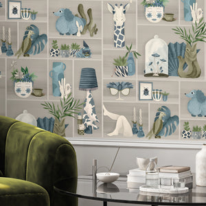 The Cabinet wallpaper by Brand McKenzie in grey, a cabinet of curiosities in a living room