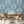 The Great Damask wallpaper by Brand McKenzie in blue, a large-scale damask in a dining area