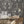 The Great Damask wallpaper by Brand McKenzie in charcoal, a large-scale damask in a dining room