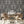 The Great Damask wallpaper by Brand McKenzie in brown, a large-scale damask behind a dining table