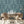 The Great Damask wallpaper by Brand McKenzie in teal, a large-scale damask in a dining area