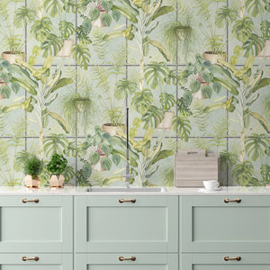 The Green House wallpaper by Brand McKenzie in green, glasshouse plants behind a console table