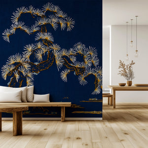 Japanese Tree wallpaper by Dami and Em Design in blue, a Japanese pine tree behind a sofa in a living room